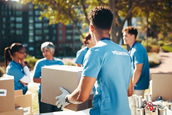 Volunteers pack boxes for a charity drive